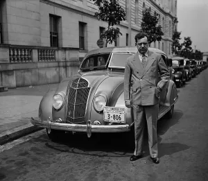 Huey Prints: Senator Huey Long stands beside his Desoto car in Washington, D.C. 1935