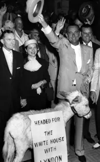 Senator Lyndon B. Johnson with Mr. and Mrs.Sam Houston Johnson (on left) surrounded by supporters during an impromtu rally prior to the Texas State Democratic Convention