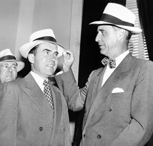 Richard Prints: Senator Prescott Bush presents a new straw hat to Vice President Richard Nixon