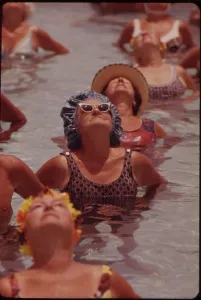 Physical Therapy Prints: Senior women in organized daily exercises in one of the public pools at Century Village Retirement Community West Palm