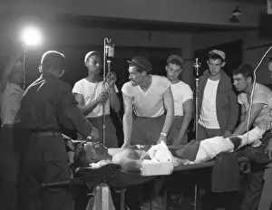 Patients Prints: Seriously wounded soldier prepped for surgery at the 121st Evacuation Hospital