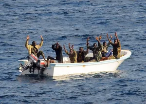 Piracy Prints: Seven suspected pirates with hands raised on orders of a U