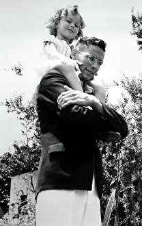 Brother Prints: Shirley Temple being carried by her brother Jack Temple