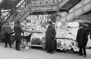 Newspapers Prints: A sidewalk newsstand in New York City displaying a rich variety of periodicals published at the turn of the century
