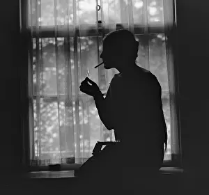 Flapper Prints: Silhouette of a stylish women smoking in 1926