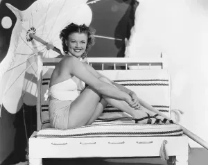Bathing Suit Prints: Simone Simon, modeling yellow sailcloth shorts