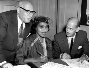 Bing Prints: Singer Marian Anderson signs a contract with Metropolitan Opera representative Rudolf Bing (right)
