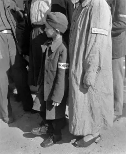 Genocide Prints: Six-year-old war orphan with a Buchenwald concentration camp badge on his sleeve