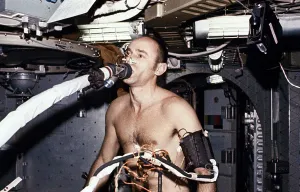Nasa Prints: Skylab 3 Astronaut Allen Bean on the ergometer, breathing into the metabolic analyzer
