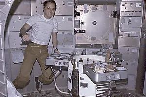 Nasa Prints: Skylab 4 Astronaut Ed Gibson preparing his meal aboard the Skylab space station