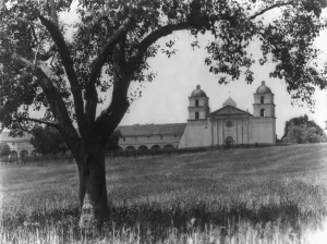 Mission Prints: In sleepy Santa Barbara, California. Mission Church in background, c. 1913