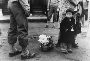 Ethnic Groups Prints: Small child looks apprehensively at the U