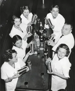 Bars Prints: Smiling men and women with cocktail shakers at Prohibition's end