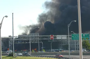 9 11 Prints: Smoke billows from the Pentagon moments after Al-Qaeda terrorists crashed hijacked American Airlines Flight 77 jetliner