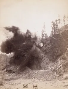 Dynamite Prints: Smoke from a dynamite blast during railroad construction near Deadwood