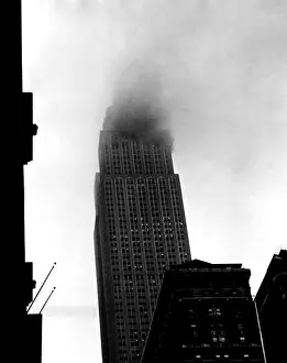 Smoke Prints: Smoke pours from the windows of the Empire State Building after a B-25 Bomber accidentally crashed into the 78th story
