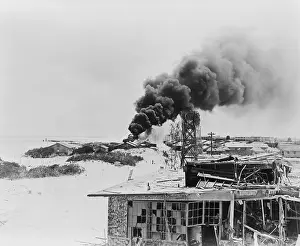 Bombers Prints: Smoke rising from burning oil tanks on Sand Island