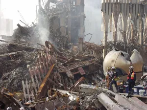 9 11 Prints: The smoking remains of the World Trade Center with the still erect lower facade