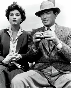 Binoculars Prints: THE SNOWS OF KILIMANJARO, Ava Gardner, Gregory Peck, 1952