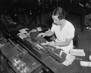 Progress Prints: Social Security Administration clerk punching tabulator operation cards