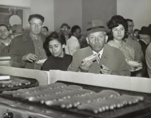 Consumer Goods Prints: Sol Handwerker eating a Famous Coney Island hot dog at SNACKTIME