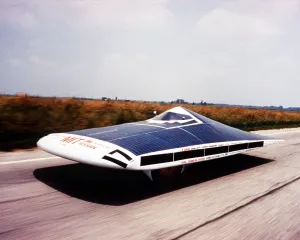 Government Programs Prints: Solar car on the road during the SUNRAYCE 1995 race of experimental solar vehicles from Indianapolis to Golden