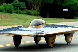 Government Programs Prints: Solar car on the road during the SUNRAYCE 1999 race of experimental solar vehicles from Washington