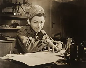 Expression Prints: Soldier-Cartoonist Bill Mauldin seated at desk in office in Il Messagero building