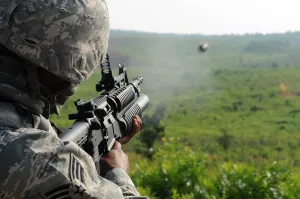 Explosives Prints: US soldier fires a practice round out of a M203 grenade launcher at Marine Corps Base Quantico Virginia