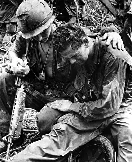 Everett Site Prints: Two soldiers comfort each other under the strain of combat in Pleiku