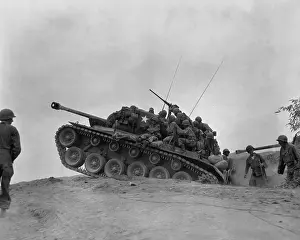 Defensive Prints: Soldiers on a M-26 tank await an North Korean attempt to cross the Naktong River