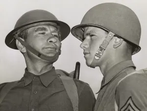 Basic Training Prints: Soldiers in the old and new Army helmets at Fort Benning, Georgia, April 25, 1941