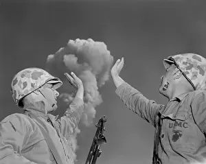 Atomic Prints: Soldiers pose below an atomic cloud at the Nevada Proving Ground