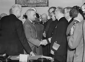 Lcgr1411 Prints: A solemn Harry Truman shakes hands with Admiral William Leahy after being sworn in as President