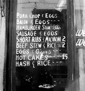 Negro Prints: Soul Food; Menu in the window of a restaurant