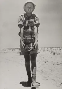 Shorts Prints: A South African with the British forces in the Western Desert holding a stack of land mines