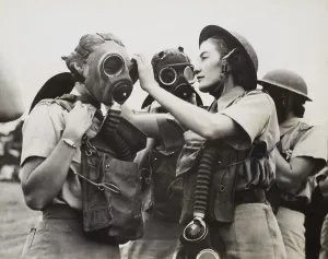 Lcgr1310 Prints: South African Women's Auxiliary Services sergeant is fitted with a gas mask