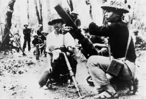 Mortars Prints: South Vietnam Viet Cong with captured US 81mm mortar. 1965