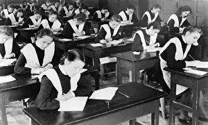 Classroom Prints: Soviet female graduates from the tenth grade writing compositions for their diplomas
