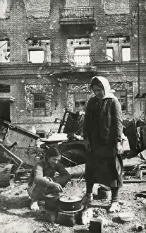 Lcgr1406 Prints: Soviet (Russian) civilians cooking in the ruins of Stalingrad