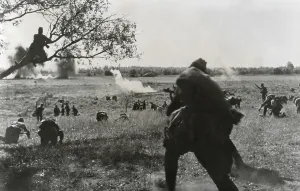 Russia Prints: Soviet Russian infantry advancing toward German lines in coordination with tanks