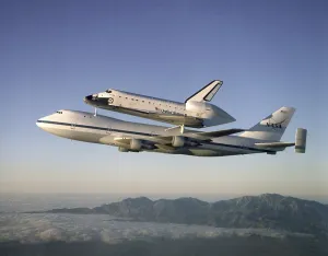 Images Dated 4th June 2012: Space shuttle Atlantis atop the a customized 747 flies piggy back to the Kennedy Space Center after a ten month