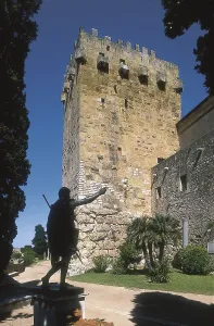SPAIN. CATALONIA. TARRAGONA. Tarragona. Roman walls. Archbishop's Tower (14th c.) and bronze statue of August. Architecture. AISA/Everett Collection**US SALES ONLY**