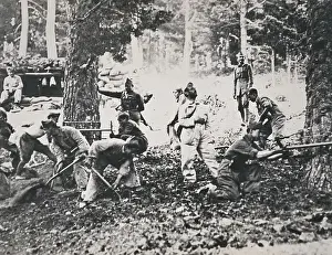 Spanish Civil War (1936-1939). Legionnaires in the front of the Sierra chopping pines and filling sandbags to make barricades against the enemy aviation