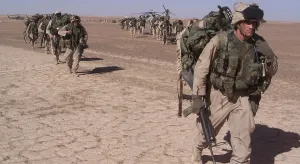 Images Dated 16th March 2011: An Special Operations infantry company move across the desert in a file after the seizure of a forward operating
