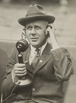 Columnist Prints: Sports Journalist Grantland Rice using telephone microphone in the 1920s