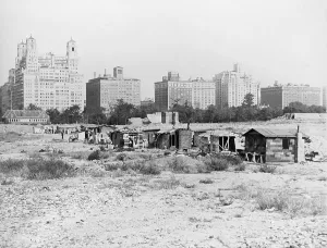 Central Park Prints: Squatter's shacks in Central Park with the landmark Dakota Apartment building in the background