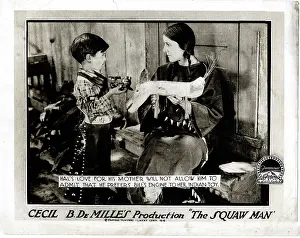 Toys Prints: THE SQUAW MAN, l-r: Pat Moore, Ann Little on lobbycard, 1918
