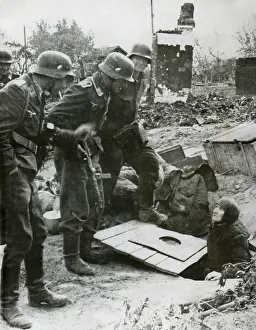 Survival Prints: In Stalingrad, German soldiers extract an old Russian elderly woman from her hiding place
