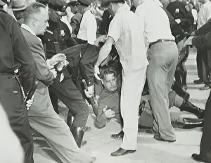 Riots Prints: State trooper on the ground after he was hit by a rioter's rock during the Paul Robeson concert